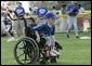 A young ballplayer from the District 12 Little League Challengers of Williamsport, Pa., works the outfield Sunday, July 24, 2005, at a Tee Ball game on the South Lawn of the White House. White House photo by Carolyn Drake