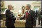 President George W. Bush welcomes U.S. Ambassador to Afghanistan Ronald Neumann to the Oval Office July 20, 2005. White House photo by Paul Morse