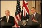 President George W. Bush gestures as he answers a reporter's question Tuesday, July 19, 2005, during a joint press availability with Australia's Prime Minister John Howard in the East Room of the White House. White House photo by Carolyn Drake