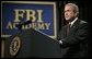 President George W. Bush delivers remarks about key accomplishments and the ongoing efforts in the war on terrorism during a visit Monday, July 11, 2005, to the FBI Academy in Quantico, Va. Said the President, "The FBI efforts are central to our success in the war on terror. And I thank you for that." White House photo by Eric Draper