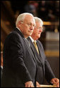 Vice President Dick Cheney and Speaker of the House Dennis Hastert stand to welcome Prime Minister Dr. Manmohan Singh of India before Dr. Singh addresses a Joint Meeting of Congress at the U.S. Capitol Tuesday, July 19, 2005. White House photo by David Bohrer