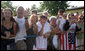 Well-wishers line the streets of Trinwillershagen, Germany, Thursday, July 13, 2006, awaiting a glimpse of President George W. Bush and Laura Bush as they arrive for a barbeque with German Chancellor Angela Merkel. White House photo by Shealah Craighead