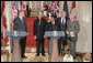 After holding a press conference with Canadian Prime Minister Stephen Harper, President George W. Bush poses with fellow birthday celebrants in the East Room Thursday, July 6, 2006. The President celebrates his 60th birthday today. Pictured with him are, from left. Todd Mizis of the U.S. State Department; Raghubir Goyal of the India Globe and Asia Today; and Richard Benedetto of USA Today. White House photo by Kimberlee Hewitt