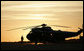 A military guard stands post next to Marine One on the tarmac at Rostock-Laage Airport Wednesday, July 12, 2006, awaiting the arrival of President George W. Bush and Mrs. Laura Bush. The couple was scheduled to visit with German Chancellor Angela Merkel before proceeding to the G8 Summit in Russia. White House photo by Paul Morse