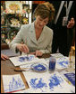 Mrs. Laura Bush participates in an arts and crafts demonstration Monday, July 17, 2006, during an exhibit at the Baltic Star Hotel on the grounds of the Konstantinovsky Palace Complex in Strelna, Russia, site of the G8 Summit that ended Monday. White House photo by Shealah Craighead