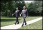 President George W. Bush and Iraqi Prime Minister Nouri al-Maliki walk from the Oval Office toward the South Lawn of the White House Wednesday, July 26, 2006, to board Marine One for their trip to Fort Belvoir, Va., to meet military personnel and families. White House photo by David Bohrer