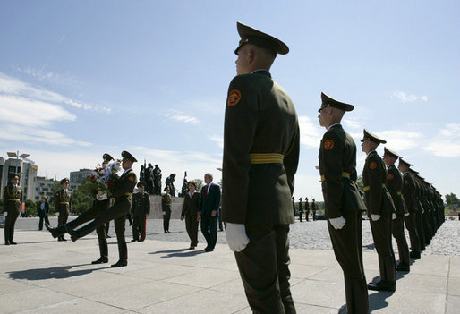 President George W. Bush and Laura Bush follow a Russian honor guard to place a wreath at the Monument to the Heroic Defenders of Leningrad, Friday, July 14, 2006, in St. Petersburg, Russia. White House photo by Eric Draper