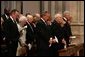 President George W. Bush bows his head during a prayer reading during the funeral service for former President Ronald Reagan at the National Cathedral in Washington, DC on June 11, 2004. White House photo by Paul Morse.