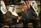 President George W. Bush shakes hands with new Iraqi President Ghazi al-Yawer at the G8 Summit on Sea Island, Ga., Wednesday, June 9, 2004. White House photo by Eric Draper.