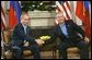 President George W. Bush shakes hands with Russian President Vladimir Putin during their bilateral meeting at the G-8 Summit in Sea Island, Ga., Tuesday, June 8, 2004. White House photo by Eric Draper