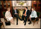 President George W. Bush and President Elias Antonio Saca Gonzalez of El Salvador meet while attending the Summit of the Americas in Mar del Plata, Argentina, Saturday, Nov. 5, 2005. White House photo by Eric Draper