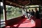 President George W. Bush, Mrs. Bush, Japan’s Prime Minister Junichiro Koizumi and the Reverend Raitei Arima, Chief Priest of the Golden Pavilion Kinkakuji Temple, pause during a cultural visit to the temple Wednesday, Nov. 16, 2005, in Kyoto. White House photo by Eric Draper