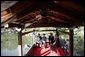 President George W. Bush, Mrs. Bush, Japan’s Prime Minister Junichiro Koizumi and the Reverend Raitei Arima, Chief Priest of the Golden Pavilion Kinkakuji Temple, share a light moment during a cultural visit to the temple Wednesday, Nov. 16, 2005, in Kyoto. White House photo by Eric Draper