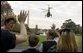 As President Bush departs the South Lawn on Marine One, emotions fly high for families following their meeting with the President and Laura Bush Monday, Nov. 14, 2005. President Bush left for a week-long trip to Asian countries. White House photo by Lynden Steele