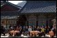 Sitting in the Korean sunlight, Laura Bush is joined by spouses of APEC leaders at the Beomeosa Temple in Busan for a morning tea ceremony. White House photo by Shealah Craighead