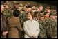 Laura Bush smiles back at the troops Saturday after she and the President stopped en route to China at Osan Air Base in Osan, Korea. White House photo by Shealah Craighead