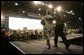 President George W. Bush and Laura Bush enter the Black Cat Hangar at Osan Air Base in Osan, Korea Saturday, Nov. 19, 2005, where the President made remarks to the troops before continuing his Asia tour. White House photo by Eric Draper