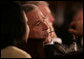 President George W. Bush listens to Secretary of State Condoleezza Rice during the opening session Friday, Nov. 4, 2005, of the 2005 Summit of the Americas in Mar del Plata, Argentina. White House photo by Eric Draper