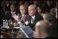 President George W. Bush and Secretary of State Condoleezza Rice listen as Prime Minister Paul Marten of Canada speaks Friday, Nov. 4, 2005, during the opening session of the 2005 Summit of the Americas in Mar del Plata, Argentina. White House photo by Eric Draper