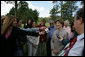 Mrs. Laura Bush smiles as she talks with the media after lunching Friday, Nov. 4, 2005, at Estancia Santa Isabel, an Argentine ranch located not far from Mar del Plata, where President George W. Bush was participating in the 2005 Summit of the Americas. White House photo by Krisanne Johnson