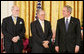 President George W. Bush stands with Presidential Medal of Freedom recipients, Vinton G. Cerf and Robert E. Kahn, Wednesday, Nov. 9, 2005, during ceremonies at the White House. Cerf and Kahn were honored for their work in helping to create the modern Internet. White House photo by Paul Morse