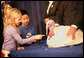 President George W. Bush invites the children of Clarksville Elementary School on stage to pet "Marshmallow", the National Thanksgiving Turkey, during the Tuesday, November 22, 2005 pardoning ceremony, held in the Eisenhower Executive Office Building in Washington. White House photo by Shealah Craighead