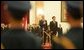 President George W. Bush and President Hu Jintao of China are viewed through the honor guard during welcoming ceremonies for the President and Mrs. Bush at the Great Hall of the People in Beijing. White House photo by Paul Morse