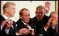 Former Mississippi Congressman and decorated war veteran, G.V. Sonny Montgomery, center, waves as he is introduced, and applauded by his fellow recipients of the 2005 Presidential Medal of Freedom, awarded Wednesday, Nov. 9, 2005 in the East Room. From left to right are, Paul Harvey, Montgomery, General Richard B. Myers and golf legend Jack Nicklaus. White House photo by Shealah Craighead