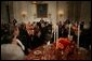 President George W. Bush welcomes guests in the State Dining Room of the White House, Thursday, Nov. 10, 2005, at the dinner celebrating the 40th Anniversary of the National Endowment for the Arts and the National Endowment for the Humanities. White House photo by Paul Morse