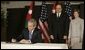 President George W. Bush and Mrs. Laura Bush, visit the Embassy of Jordan to sign a book of condolence, Thursday, Nov. 10, 2005 in Washington, in remembrance of those killed in the terrorist attacks, Wednesday, in Jordan. White House photo by Eric Draper