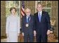 President George W. Bush and Laura Bush stand with arts advocate Leonard Garment, recipient of the 2005 National Medal of Arts, in the Oval Office Thursday, Nov. 10, 2005. White House photo by Eric Draper