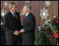 President George W. Bush is welcomed to the Asian-Pacific Economic Cooperation summit in Sydney by Australia’s Prime Minister John Howard Saturday, Sept. 8, 2007, at the Sydney Opera House. White House photo by Chris Greenberg