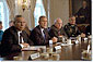 Accompanied by Secretary of State Colin Powell, far left, Vice President Dick Cheney and Chairman of the Joint Chiefs of Staff Hugh Shelton (far right), President George W. Bush talks with the press about the previous day's terrorist attacks during a cabinet meeting Sept. 12, 2001. White House photo by Tina Hager.