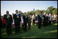 President George W. Bush and Laura Bush stand for the singing of the national anthem during a visit with military support organizations Tuesday, Sept. 18, 2007, on the South Lawn. White House photo by Eric Draper