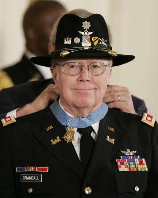 President George W, Bush presents the Medal of Honor to U.S. Army Major Bruce P. Crandall in the East Room of the White House, Monday, Feb. 26, 2007, for his extraordinary heroism as a 1st Cavalry helicopter flight commander in the Republic of Vietnam in November 1965. White House photo by Paul Morse