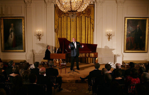 President George W. Bush and Mrs. Laura Bush listen to tenor Ronan Tynan performing in the East Room of the White House Sunday evening, Feb. 25, 2007, during the State Dinner in honor of the Nation’s Governors. White House photo by Shealah Craighead