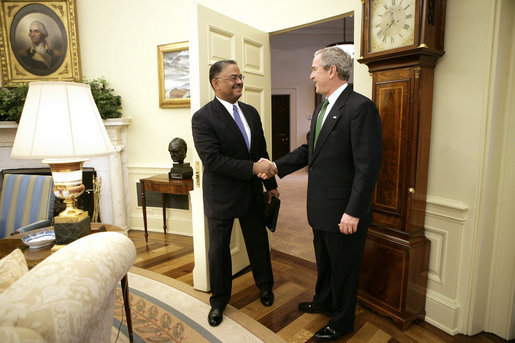 President George W. Bush welcomes U.S. Coast Guard Rear Admiral Stephen W. Rochon to the Oval Office Tuesday, Feb. 20, 2007. The New Orleans native was announced Tuesday, Feb. 27, 2007, as Director of the Executive Residence and Chief Usher. He will be the eighth Chief Usher of the White House. White House photo by Eric Draper