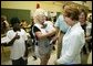 Laura Bush visits with local residents and volunteer workers at the Red Cross Disaster Relief Family Services. located at the Vero Beach Community Center in Vero Beach, Fla., Friday, Oct. 1, 2004. The City of Vero Beach was one of the areas hardest hit by Hurricanes Jeanne and Frances. White House photo by Joyce Naltchayan.