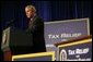 President George W. Bush speaks during the signing of H.R. 1308, the Working Families Tax Relief Act of 2004, at the South Suburban YMCA in Des Moines Iowa, Monday, Oct. 4, 2004. White House photo by Tina Hager