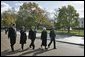 After speaking at the ceremonies in which Pennsylvania Avenue was opened as a pedestrian park, Laura Bush walks with, from left, Chairman of the National Capital Planning Commission John Cogbill; landscape architect Michael Van Valkenburgh; Federal Highway Administration Administrator Mary Peters; and Washington, D.C., Mayor Anthony Williams along Pennsylvania Avenue Tuesday, Nov. 9, 2004. White House photo by Susan Sterner.