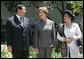 Laura Bush talks with Mr. Jose Miguel T. Arroyo of the Philippines and Mrs. Kristiani Herawati of Indonesia during a program for leaders' spouses in Santiago, Chile, Nov. 20, 2004.White House photo by Susan Sterner