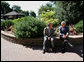 President George W. Bush speaks with Mexico’s President Felipe Calderón Tuesday, Aug. 21, 2007, prior to their meeting with Canadian Prime Minister Stephen at the North American Leaders’ Summit in Montebello, Quebec. White House photo by Eric Draper