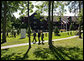 President George W. Bush walks with Canadian Prime Minister Stephen Harper, center, and Mexican President Felipe Calderón Tuesday, Aug. 21, 2007, during the North American Leaders' Summit outside the Fairmont Le Chateau Montebello in Montebello, Canada. White House photo by Eric Draper