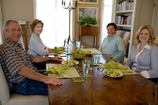 President George W. Bush and Mrs. Laura Bush sit with U.S. Attorney General Alberto Gonzales and his wife, Rebecca, during a visit Sunday, Aug. 26, 2007, at the Bush Ranch in Crawford, Texas. The Attorney General's resignation was announced Monday morning. In a statement, the President said, "Al Gonzales is a man of integrity, decency and principle. And I have reluctantly accepted his resignation, with great appreciation for the service that he has provided for our country." White House photo by Chris Greenberg