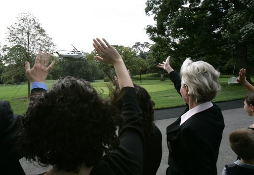 Families of victims of 911 wave goodbye as President George W. Bush and Mrs. Bush depart the White House aboard Marine One, Saturday, Sept. 11, 2004. White House photo by Eric Draper