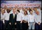 President George W. Bush greets workers following his remarks on the economy and tax relief in Kernersville, N.C., where he toured the John Deere-Hitachi excavator assembly line, Monday, Dec. 5, 2005. White House photo by Eric Draper