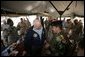 Vice President Dick Cheney has lunch with US and Iraqi troops at the 9th Mechanized Infantry Division Headquarters, a training facility for Iraqi troops, Sunday Dec 18, 2005. White House photo by David Bohrer