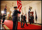 President George W. Bush and Australian Prime Minister pass an honor guard as the walk together through the Cross Hall Friday, March 28, 2008, after a joint press availability in the East Room of the White House. White House photo by Eric Draper