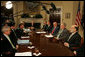 President George W. Bush is flanked by Ben Bernanke, Chairman of the Federal Reserve, and Hank Paulson, Secretary of the Treasury, during a meeting at the White House Monday, March 17, 2008, with the President's Working Group on Financial Markets. White House photo by Joyce N. Boghosian