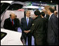 President George W. Bush stops to talk to the manufacturers of a converted plug-in hybrid electric vehicle during his tour of the Washington International Renewable Energy Conference 2008 Wednesday, March 5, 2008, at the Washington Convention Center in Washington, D.C. White House photo by Chris Greenberg